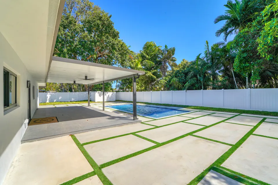 Covered patio and pool with grass pavers